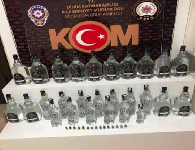 Didim’de sahte içki ve kaçak cep telefonu operasyonu